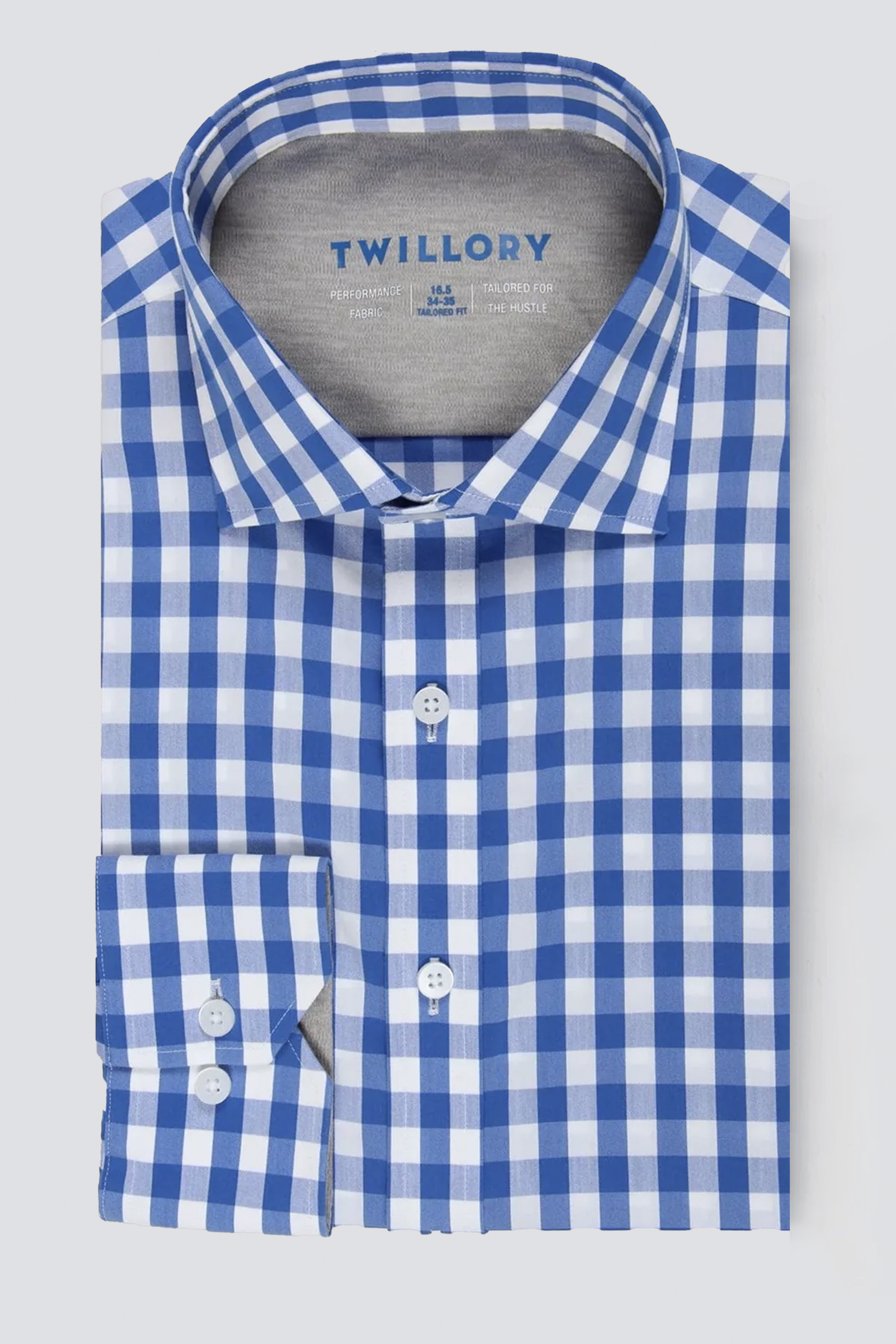 The Twillory Leader Gingham // Blue White is a long-sleeved, 4-way stretch performance shirt with a blue and white check pattern, spread collar, white buttons, and the Twillory brand on the inner lining for stylish comfort.