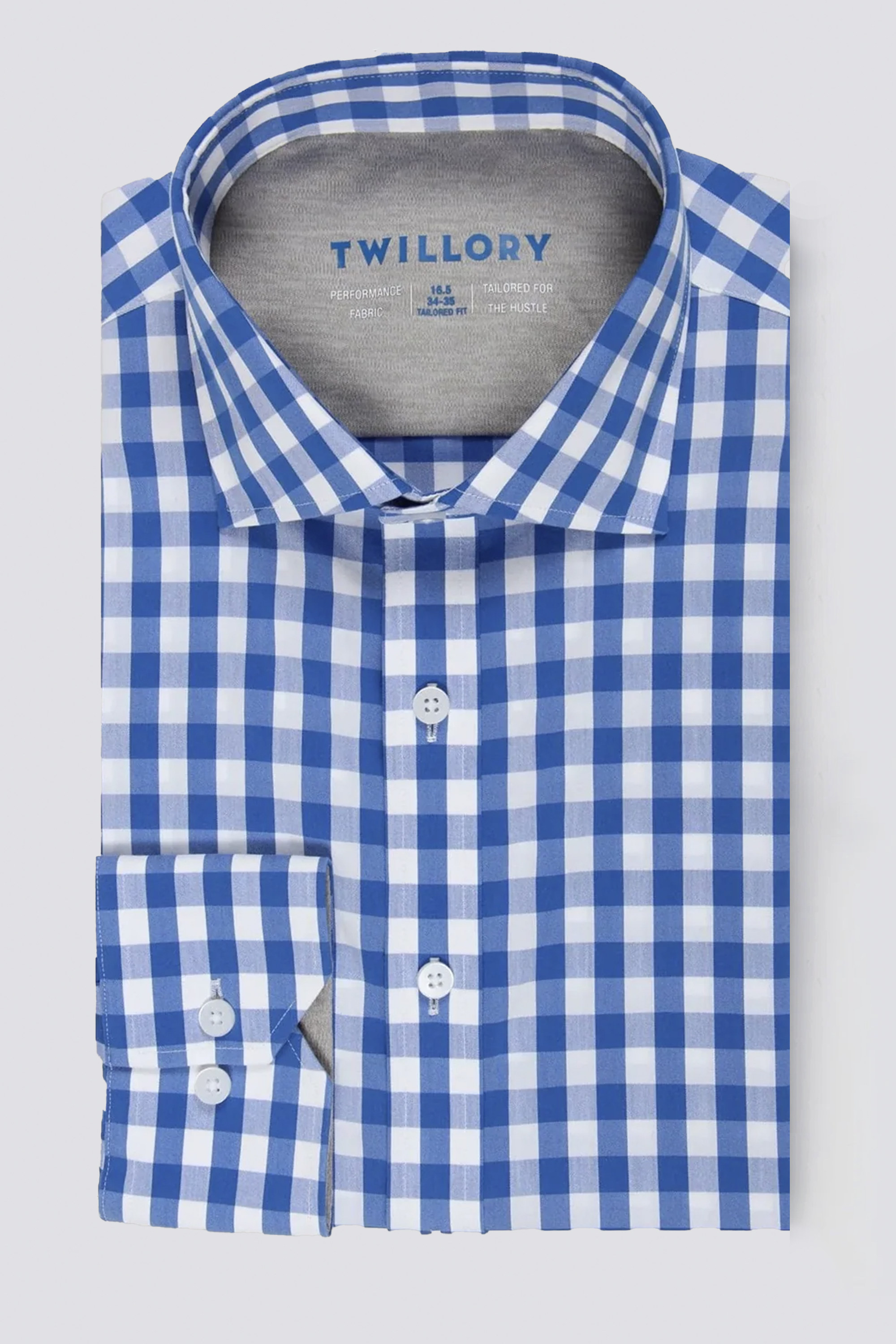 The Twillory Leader Gingham // Blue White is a long-sleeved, 4-way stretch performance shirt with a blue and white check pattern, spread collar, white buttons, and the Twillory brand on the inner lining for stylish comfort.
