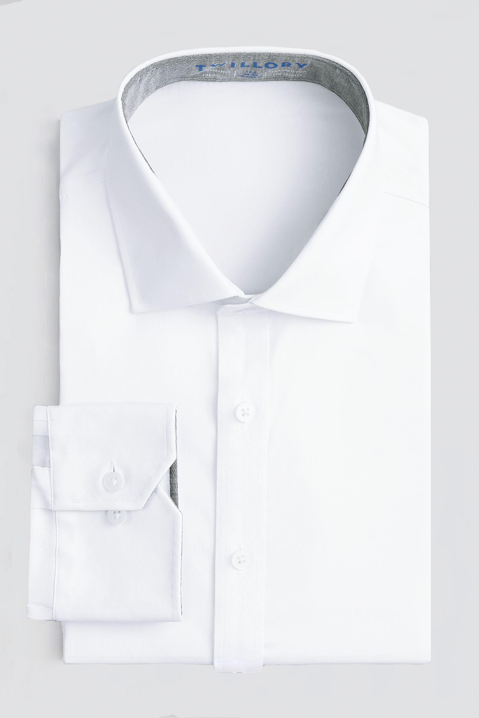 The Leader Solid // White is a long-sleeve, non-iron white dress shirt with a stiff collar and buttoned cuffs, neatly folded and displayed on a light background.