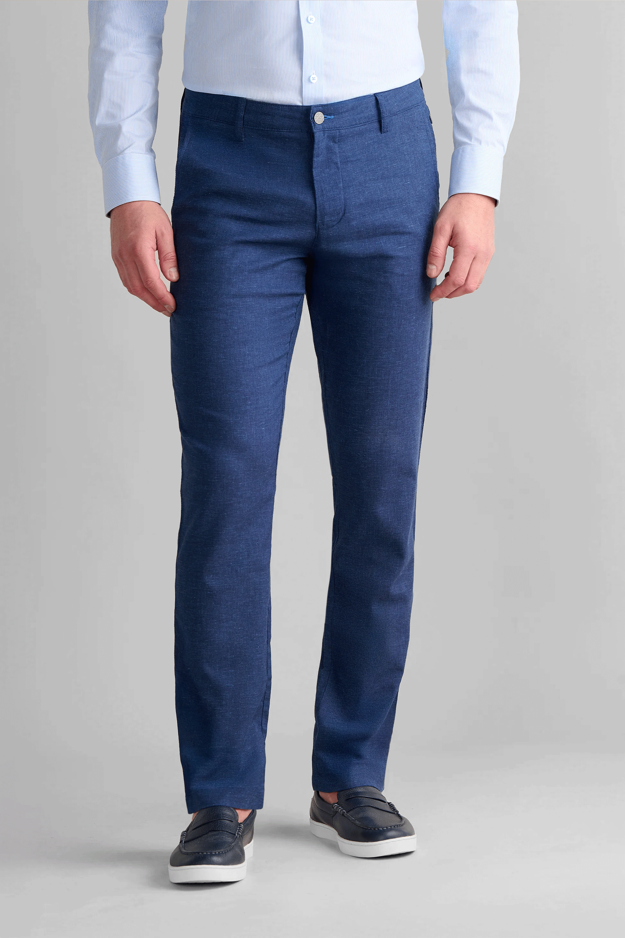 Twillory Performance Linen Pants in Blue: A non-iron, machine-washable fabric blend ($45\%$ linen, $36\%$ viscose, $19\%$ polyester) featuring 4-way stretch and a shirt-gripping waistband. These moisture-wicking, breathable tailored trousers include zippered travel pockets and a slight taper for a professional summer look.