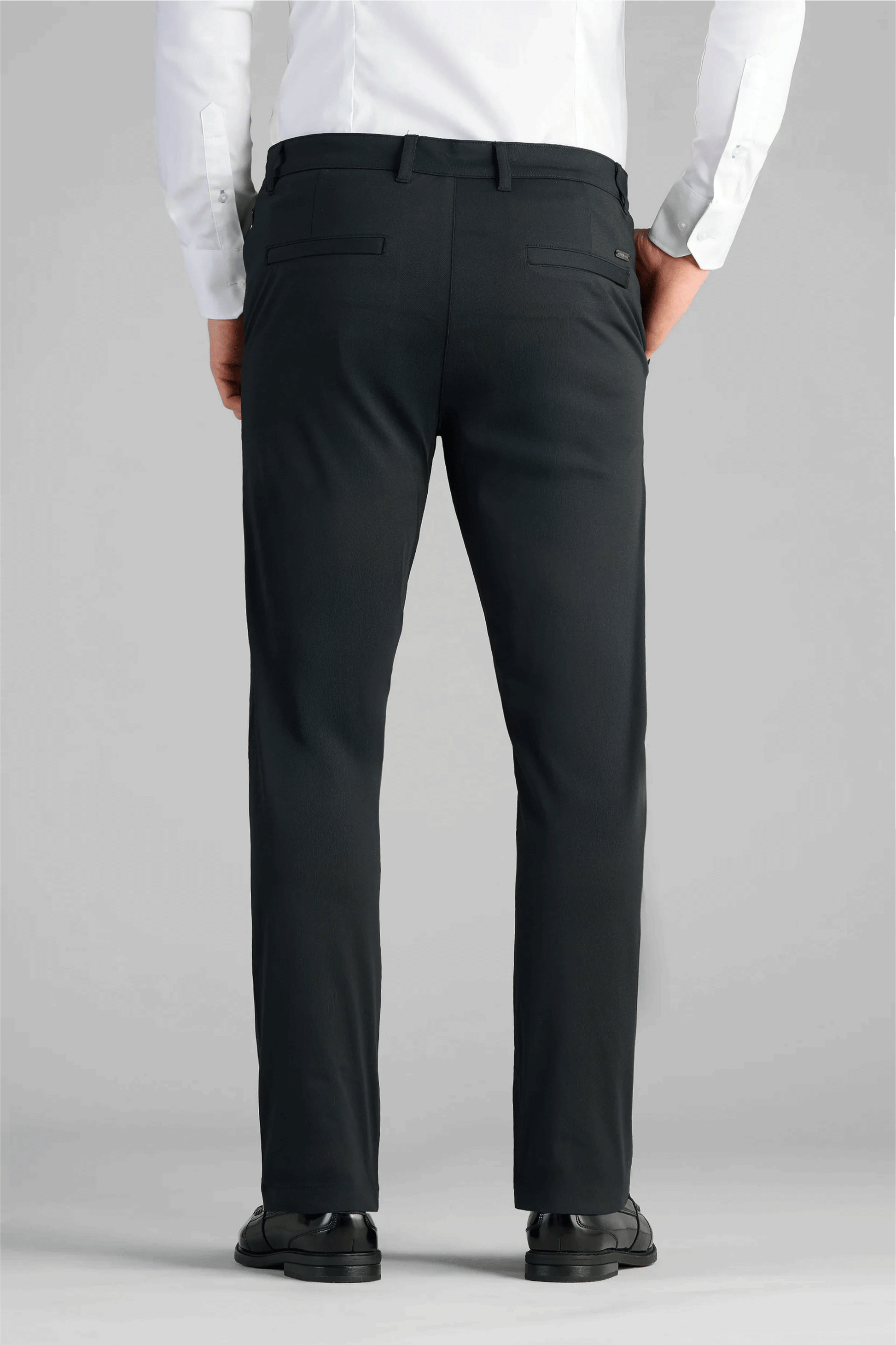 A man wearing Performance Pants in black.