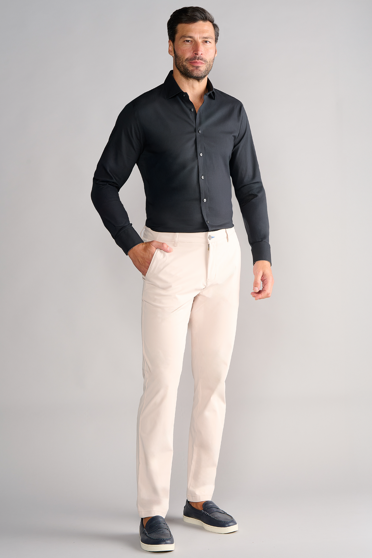 A man wearing the Twillory Leader Solid // Black stretch dress shirt.