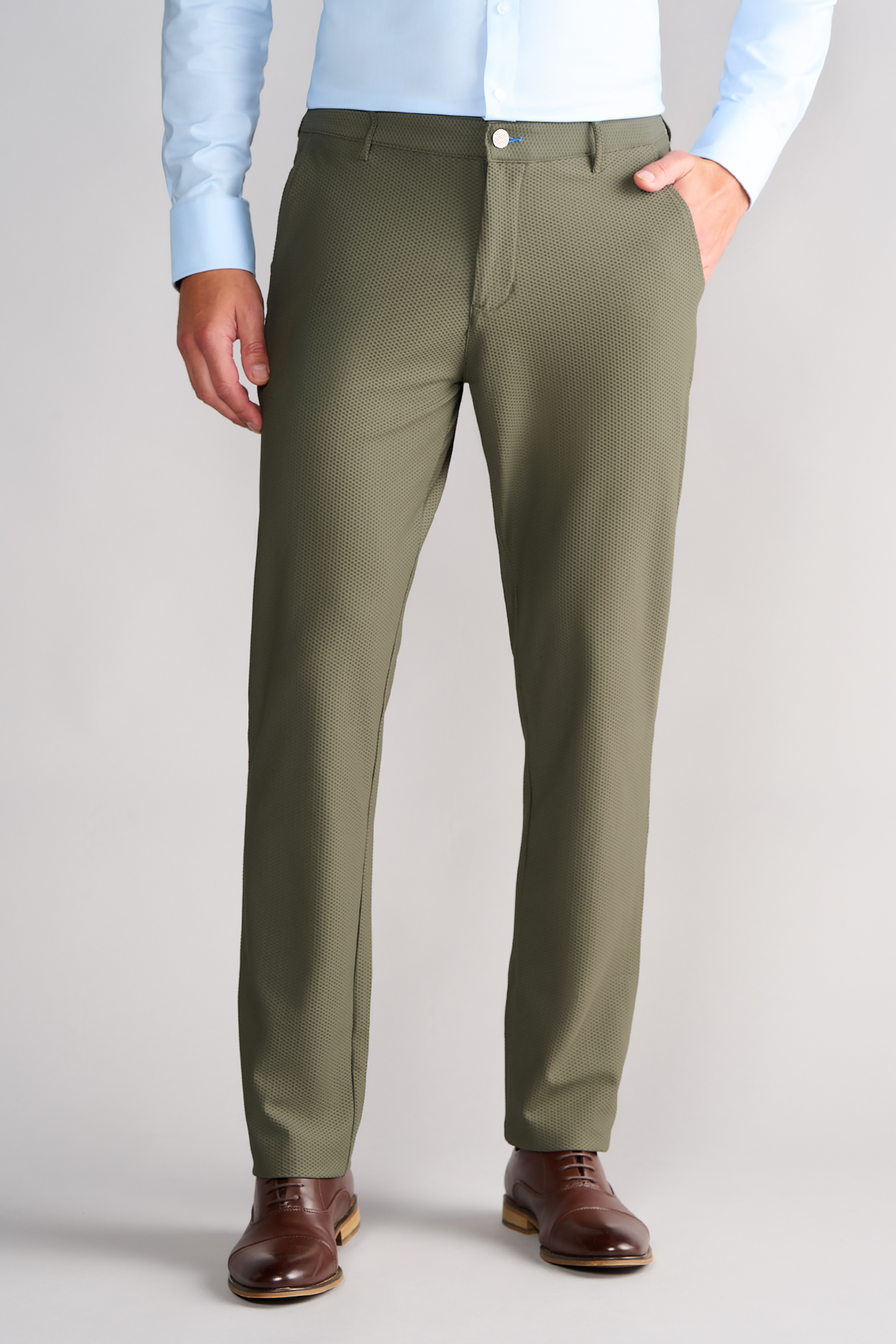 A man wearing Twillory's AIR Pants in Olive, made with 360° Airflow Fabric.