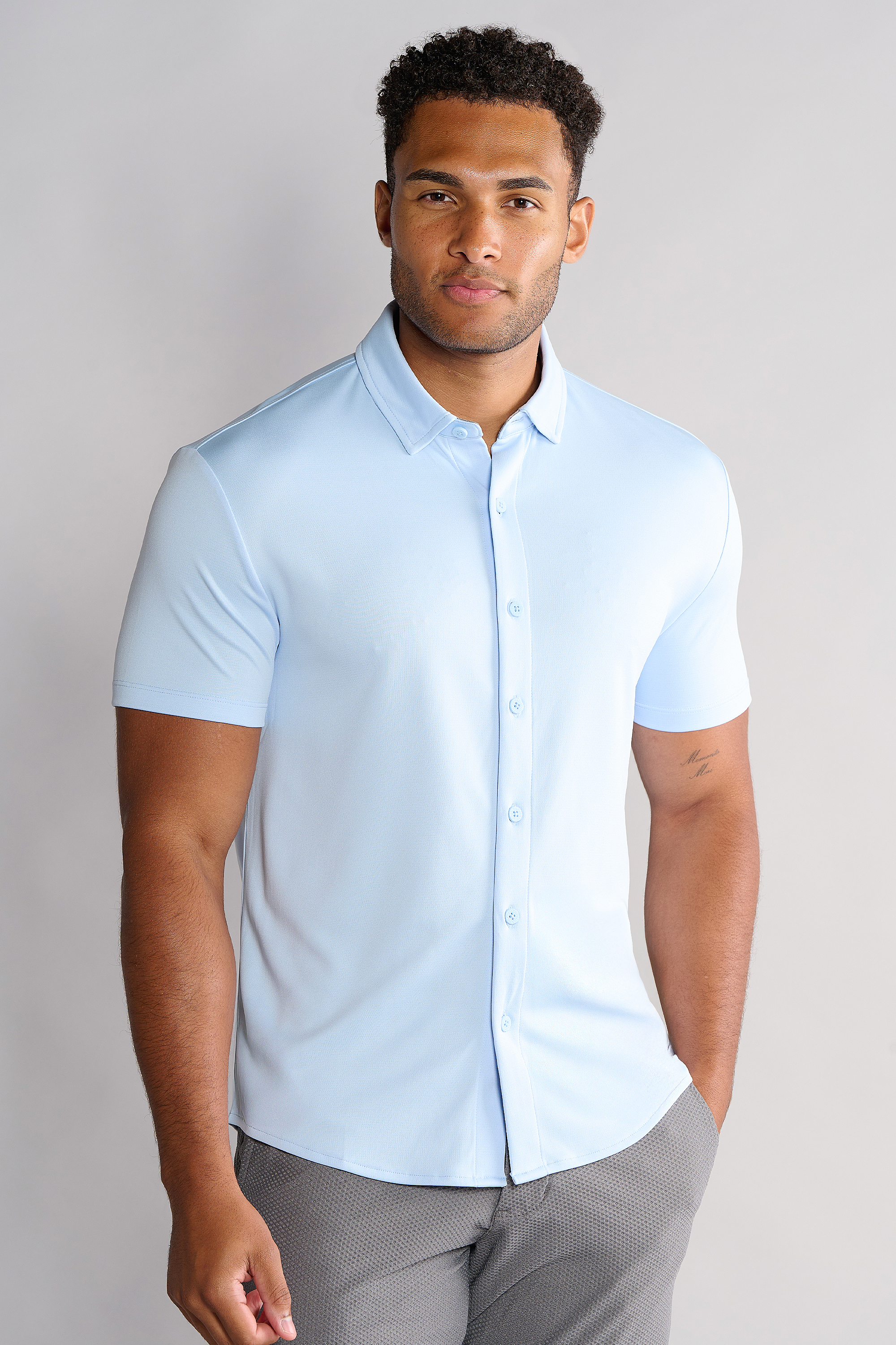 A man in a powder blue Twillory Short Sleeve Button Down Polo.