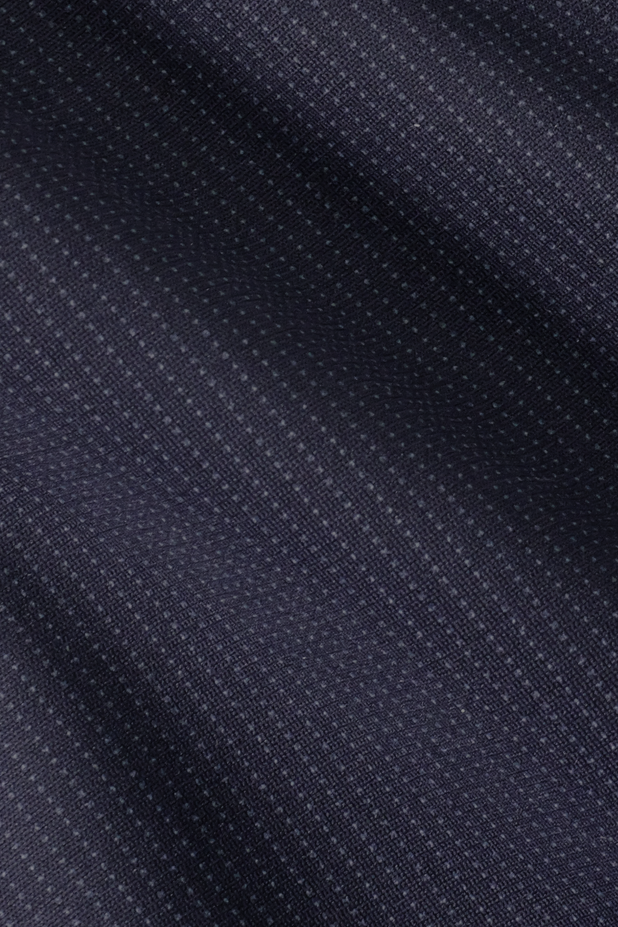 The Twillory Performance Blazer // Navy Pin Stripe features a dark navy blue fabric with subtle diagonal stripes of light blue dots, a soft, slightly reflective texture, and minimalist design for a stylish, refined formal look.