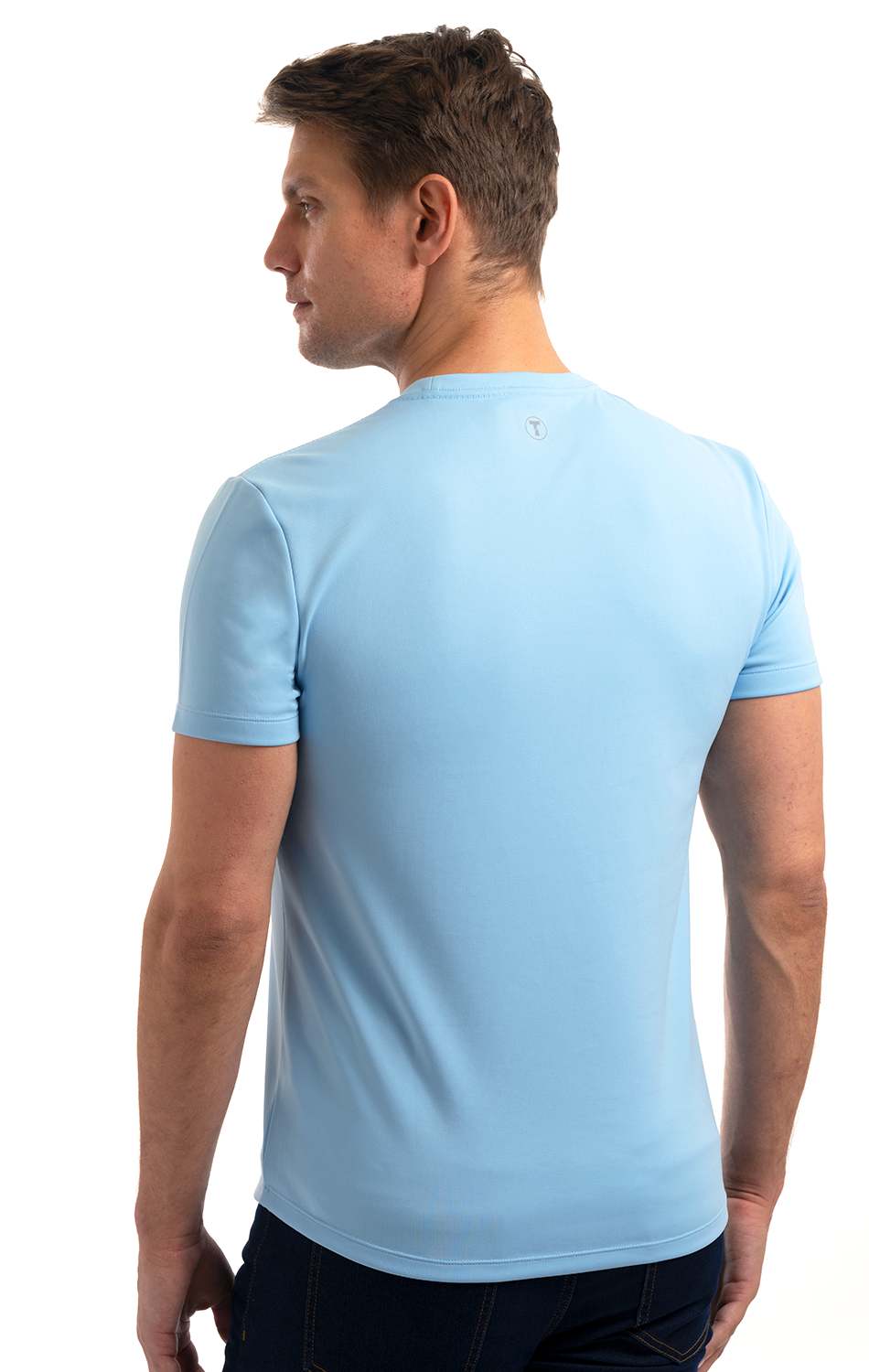 Man wearing a light blue short-sleeve t-shirt viewed from the back.