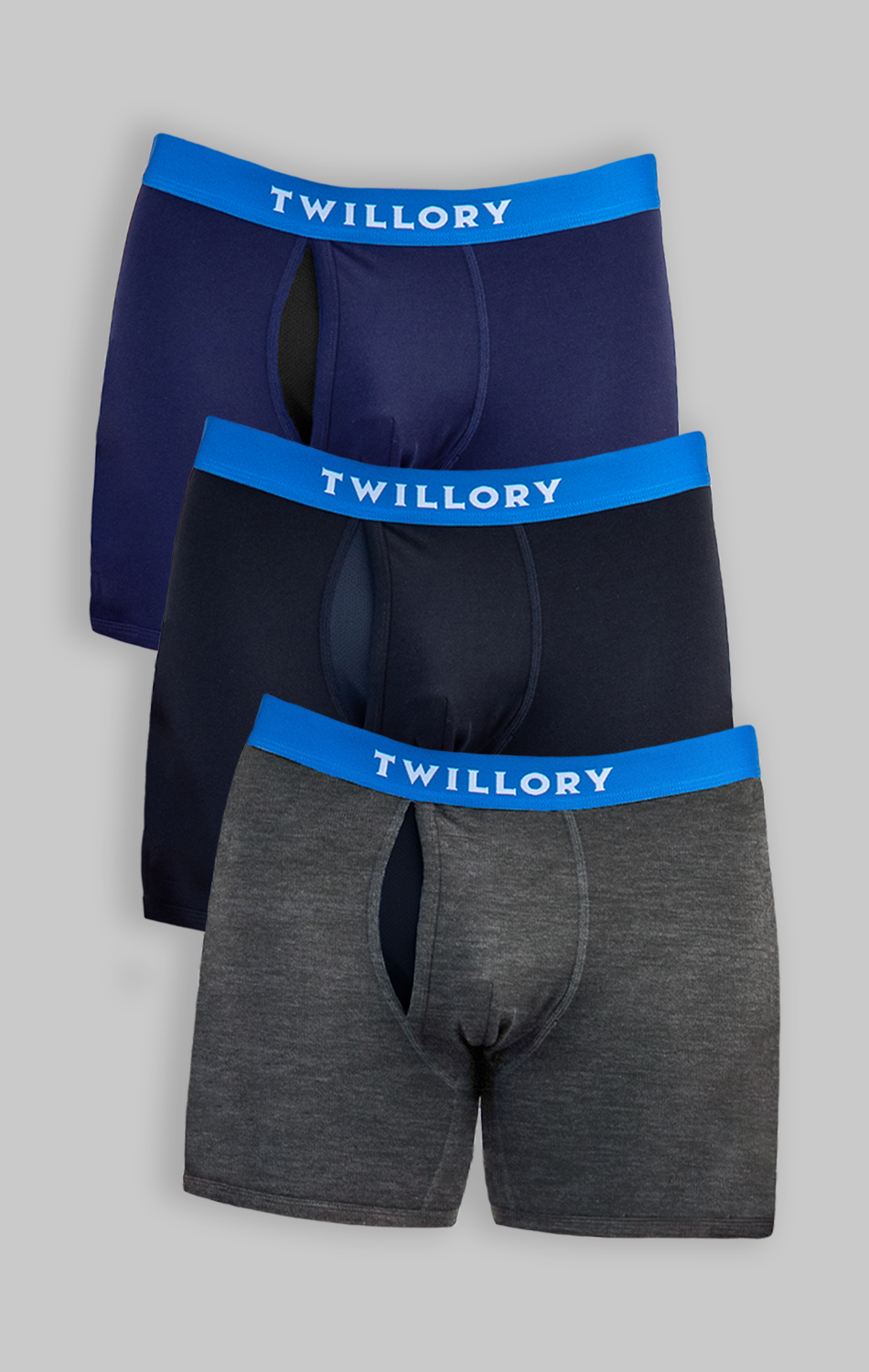 The Twillory Performance Boxer Briefs 3 Pack features men's navy, black, and dark gray underwear with blue waistbands and white Twillory logos. Each pair offers a supportive pouch and anti ride-up comfort on a gray background.
